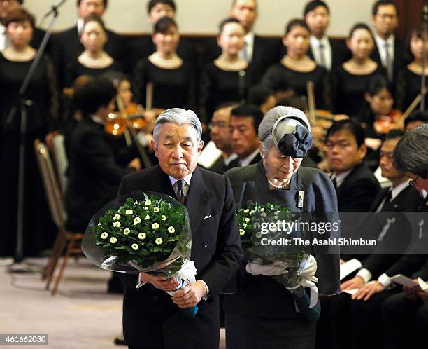 Emperor Akihito and Empress Michiko offer flowers to an altar during the memorial ceremony to mark the 20th anniversary of the Great Hanshin...