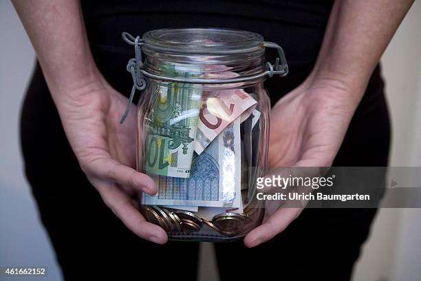 You can save on different art. Saved money in a preserving jar, on January 16, 2015 in Bonn, Germany.