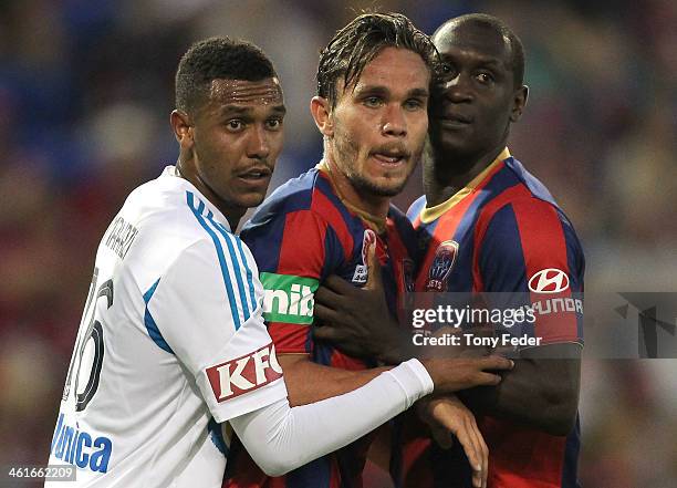 Rashid Mahazi of the Victory James Brown and Emile Heskey of the Jets wait for a corner kick during the round 14 A-League match between the Newcastle...