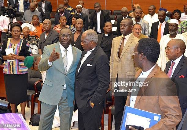 Central African president Michel Djotodia speaks with unidentified members of the Central African parliament one the second day of the special summit...