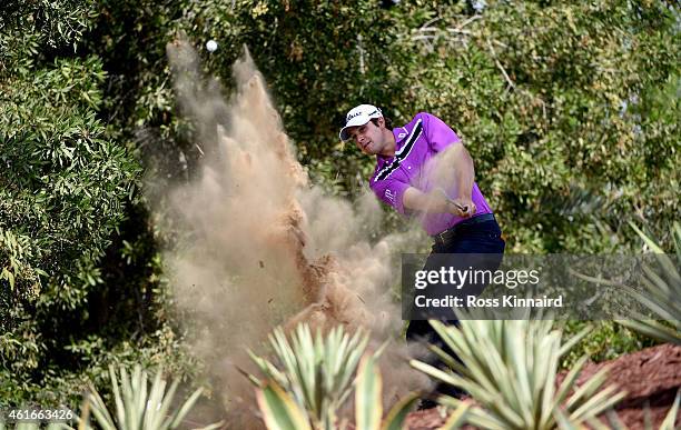 Peter Uihlein of the USA plays his third shot on the far five 2nd hole during the third round of the Abu Dhabi HSBC Golf Championship at the Abu...