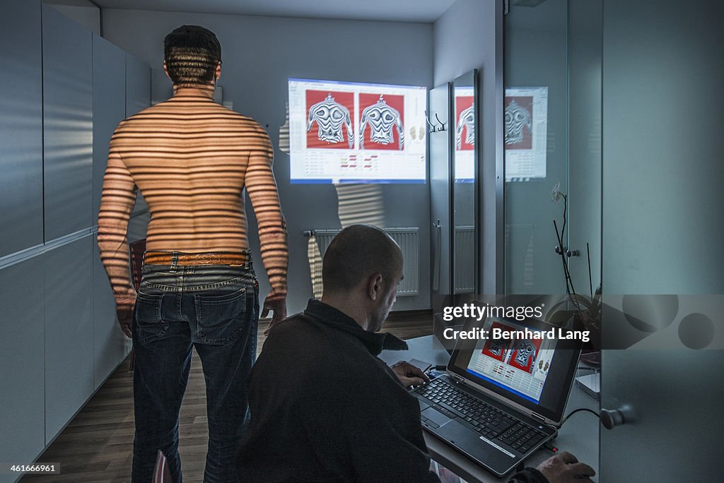 Back of a man getting analyzed by therapist
