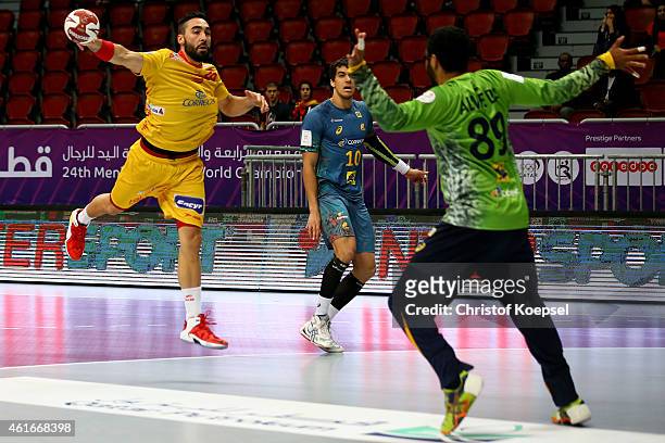 Jose Maria Rodriguez of Spain scores a goal against Cesar Augusto Almeida of Brazil during the IHF Men's Handball World Championship group A match...