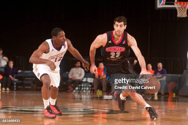 Tornike Shengelia of the Springfield Armor dribble up court guarded by Othyus Jeffers of the Iowa Energy during the 2014 NBA D-League Showcase on...