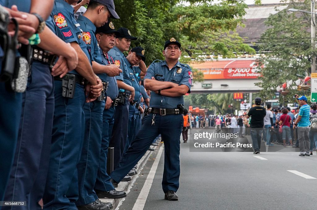A member of the Philippine National Police (PNP) looks at...