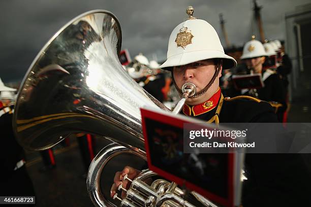 The band of the Royal Marines plays as HMS Illustrious arrives into Portsmouth Harbour on January 10, 2014 in Portsmouth, England. The ships returns...