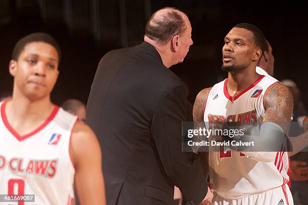 Romero Osby of the Maine Red Claws greets assistant coach Paul Mokeski of the Rio Grande Valley Vipers following a game during the 2014 NBA D-League...