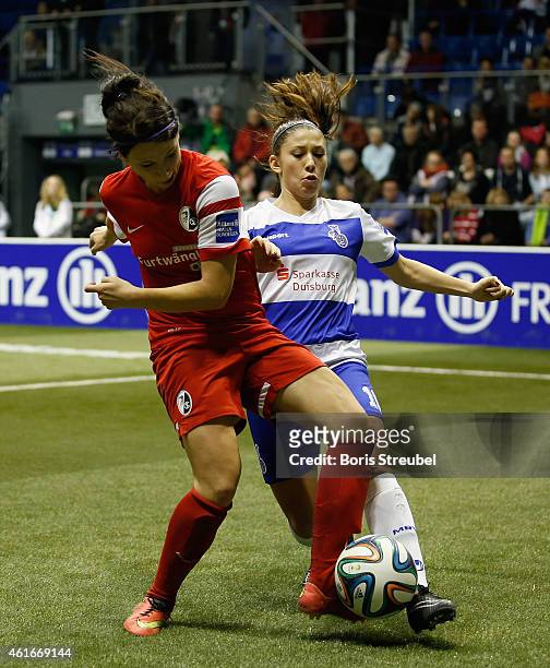 Sylvia Arnold of SC Freiburg battles for the ball with Carmen Pulver of MSV Duisburg during the DFB Women's Indoor Football Cup 2015 match between...