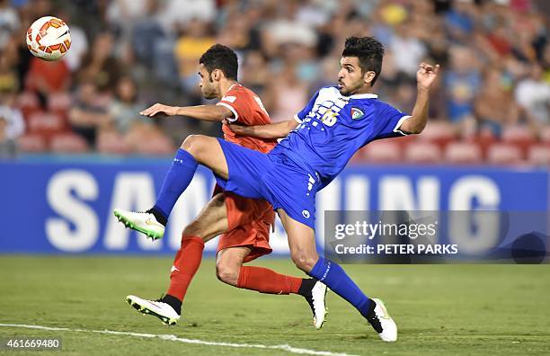 Suliman Al Busaidi of Oman and Fahad Al Ebrahim of Kuwait fight for the ball during their Group A football match of the AFC Asian Cup in Newcastle on...