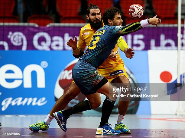 Jorge Maqueda of Spain defends against Diogo Hubner of Brazil during the IHF Men's Handball World Championship group A match between Brazil and Spain...