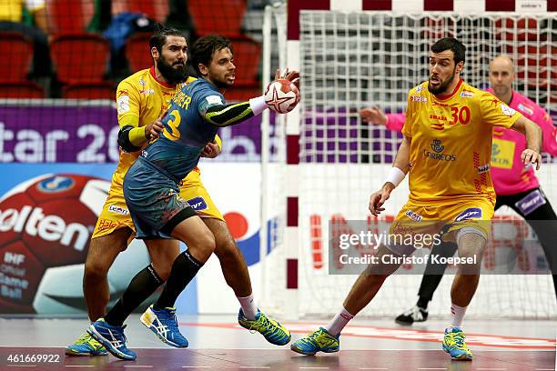 Jorge Maqueda of Spain and Gedeon Guardiola of Spain defend against Diogo Hubner of Brazil during the IHF Men's Handball World Championship group A...