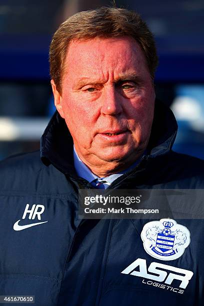 Harry Redknapp the QPR manager looks on before the Barclays Premier League match between Queens Park Rangers and Manchester United at Loftus Road on...