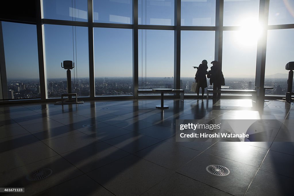 Women viewing cityscape from the observation floor