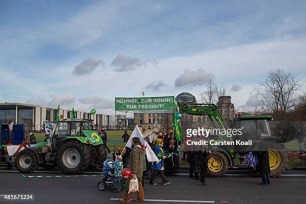 Dozens of tractors are parked after farmers from across Germany marched to protest against industrialized agriculture, the TTIP trade agreement and...