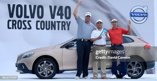 Dawie Van Der Walt of South Africa and Joost Luiten of The Netherlands with their amateur playing partner Enrique Vilchis Calderon of Mexico after...