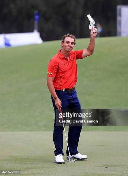 Joost Luiten of Netherlands waves to the crowd on the 18th green during the second round of the 2014 Volvo Golf Champions at Durban Country Club on...