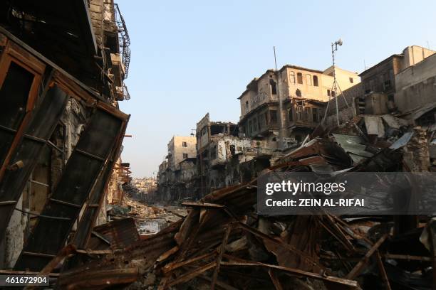 Picture taken on January 17 shows a heavily damaged street on the rebel-controlled side of the northern Syrian city of Aleppo. More than 200,000...