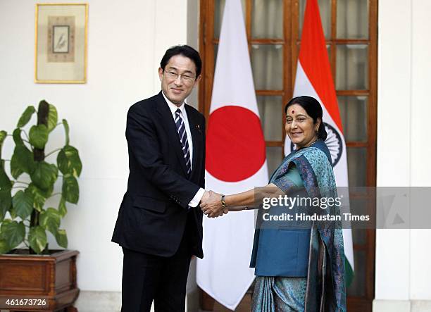 Japan's Foreign Minister Fumio Kishida with Indian External Affairs Minister Sushma Swaraj before their meeting, on January 17, 2015 in New Delhi,...