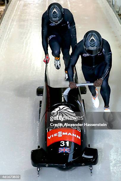 Pilot Lamin Deen and Toby Olubi of Great Britain compete during the Viessmann FIBT Bob World Cup at Deutche Post Eisarena on January 17, 2015 in...