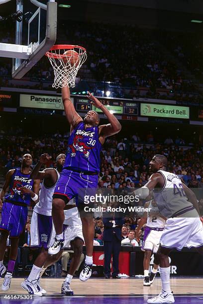 Oliver Miller of the Toronto Raptors shoots the ball during a game played on January 30, 1996 at Arco Arena in Sacramento, California. NOTE TO USER:...