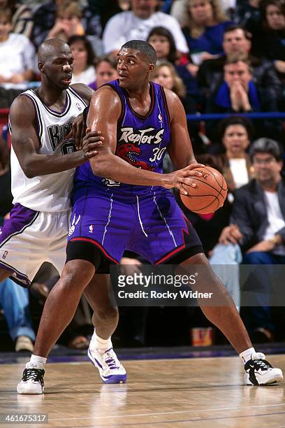 Oliver Miller of the Toronto Raptors posts up during a game played on January 30, 1996 at Arco Arena in Sacramento, California. NOTE TO USER: User...