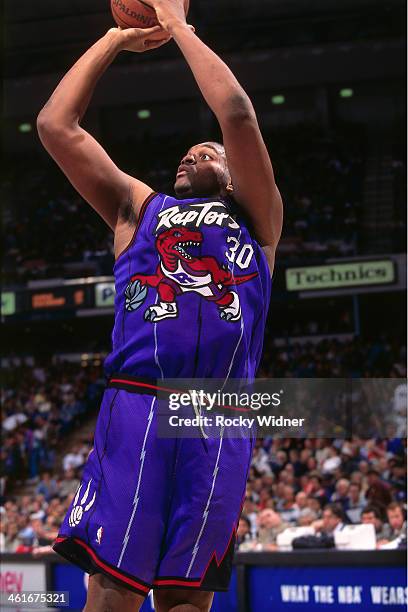 Oliver Miller of the Toronto Raptors shoots the ball during a game played on January 30, 1996 at Arco Arena in Sacramento, California. NOTE TO USER:...