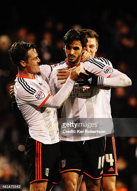 Bryan Ruiz of Fulham celebrates with team mate Scott Parker after scoring the winning goal during the Sky Bet Championship match between Fulham and...