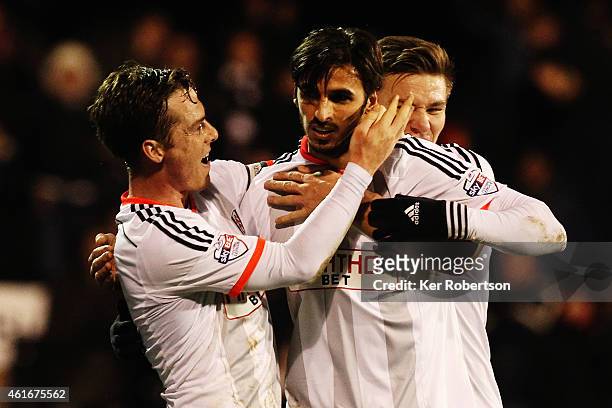 Bryan Ruiz of Fulham celebrates with team mate Scott Parker after scoring the winning goal during the Sky Bet Championship match between Fulham and...