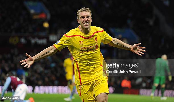 Rickie Lambert of Liverpool celebrates after scoring the second during the Barclays Premier League match between Aston Villa and Liverpool at Villa...