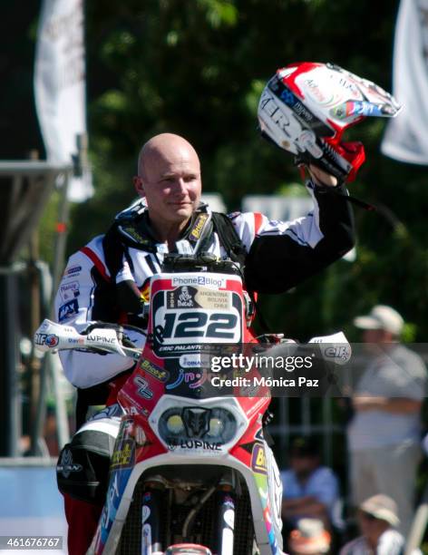 Belgium motorbike pilot Eric Palante rides his Honda during the official launch of 2014 Dakar Rally at The National Flag Memorial on January 04, 2014...