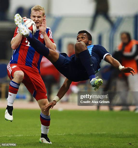 Sebastian Rode of Muenchen is challenged by Sultan Abdullah Alduayyi of Al-Hilal during the friendly match between Al Hilal and Bayern Muenchen on...