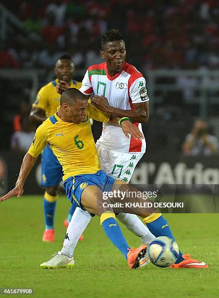 Gabon's Johann Obiang vies with Burkina Faso's Jonathan Zongo during the 2015 African Cup of Nations group A football match between Burkina Faso and...