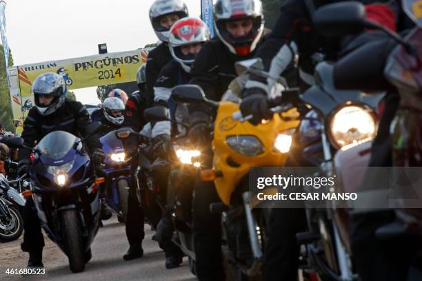 Motorcycle enthusiasts leave Puente Duero in Valladolid during the 33rd edition of the "Pinguinos" on 10 January 2014. Pinguinos is said to be the...