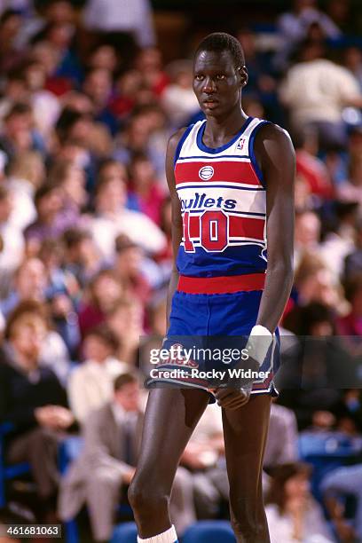 Manute Bol of the Washington Bullets walks during a game played on February 14, 1987 at Arco Arena in Sacramento, California. NOTE TO USER: User...