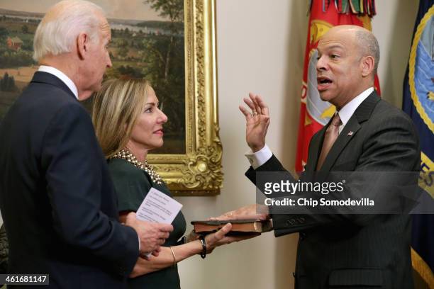Vice President Joe Biden ceremonially swears in Homeland Security Secretary Jeh Johnson with his wife Dr. Susan DiMarco in the Roosevelt Room at the...