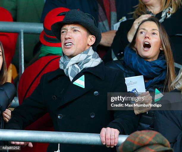 Frankie Dettori and wife Catherine Dettori cheer as they watch Dodging Bullets run to victory in the Sodexo Clarence House Steeple Chase during the...