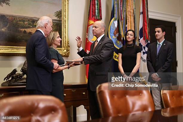 Vice President Joe Biden ceremonially swears in Homeland Security Secretary Jeh Johnson with his wife Dr. Susan DiMarco and his children Natalie...