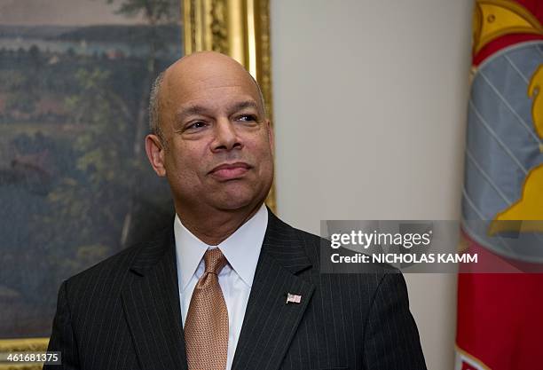 New US Homeland Security Secretary Jeh Johnson attends a ceremonial swearing-in ceremony in the Roosevelt Room at the White House in Washington,DC on...