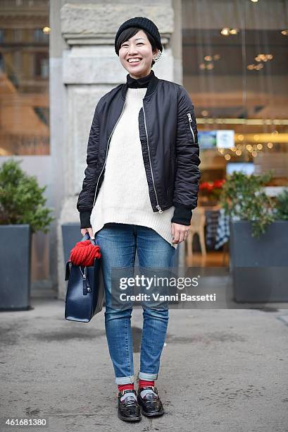 Chikako Ichinoi poses wearing a Topshop bomber, Strasburgo sweater and Marni bag on January 17, 2015 in Milan, Italy.