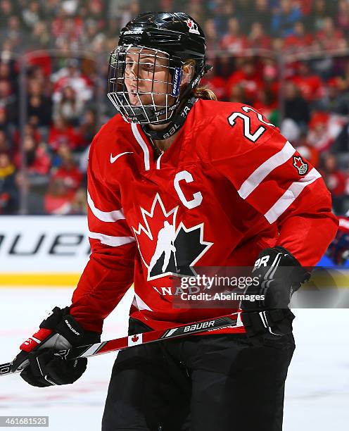 Hayley Wickenheiser of Team Canada skates up the ice against Team USA during a Sochi preparation game at the Air Canada Centre December 30, 2013 in...