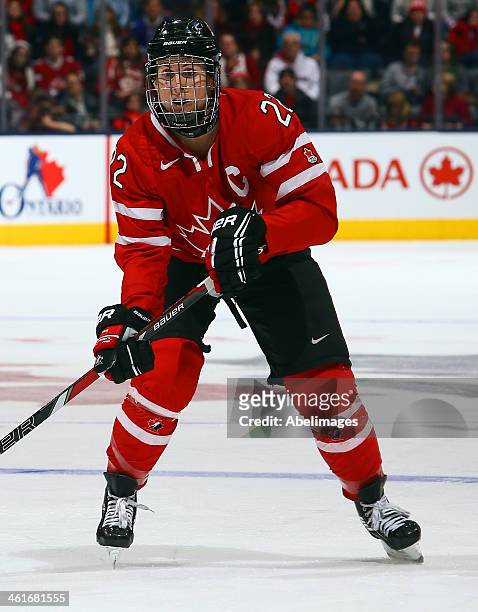 Hayley Wickenheiser of Team Canada skates up the ice against Team USA during a Sochi preparation game at the Air Canada Centre December 30, 2013 in...