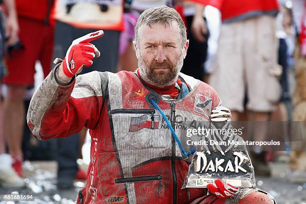 Rafal Sonik of Poland for Sonik Team YFM700R Raptor Yamaha celebrates victory on the podium in front of his team during Day 14 of the Dakar Rally at...