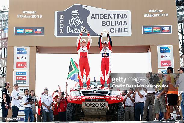 Giniel De Villiers of South Africa and Dirk Von Zitzewitz of Germany for Toyota Imperial Team South Africa in the Pick Up Hilux celebrate their 2nd...