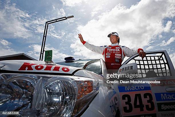 Jun Mitsuhashi of Japan for Team Land Cruiser Toyota Auto Body VDJ200 greets the fans prior to entering the podium during Day 14 of the Dakar Rally...