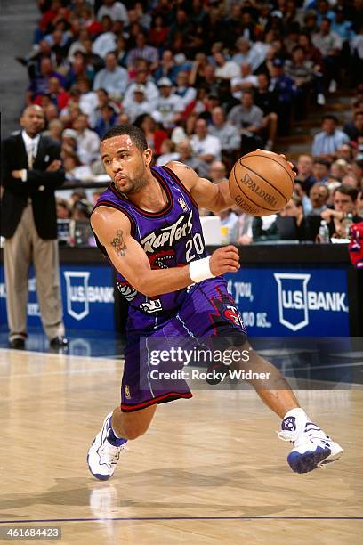 Damon Stoudamire of the Toronto Raptors dribbles the ball during a game played on March 3, 1997 at Arco Arena in Sacramento, California. NOTE TO...