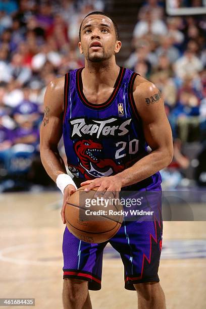 Damon Stoudamire of the Toronto Raptors shoots a foul shot during a game played on March 3, 1997 at Arco Arena in Sacramento, California. NOTE TO...