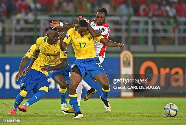 Burkina's forward Jonathan Pitroipa vies with Gabon's midfielder Andre Biyogo Poko during the 2015 African Cup of Nations group A football match...