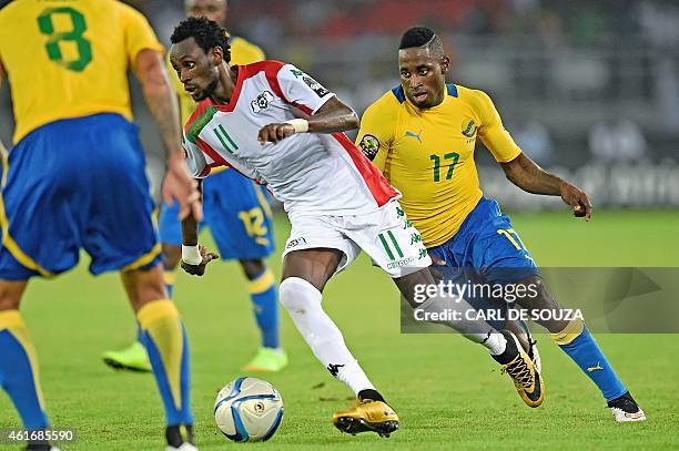 Burkina's forward Jonathan Pitroipa vies with Gabon's midfielder Andre Biyogo Poko during the 2015 African Cup of Nations group A football match...