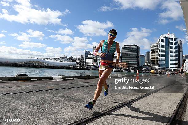 Winner Tim Reed of Australia runs along Princes Wharf during Ironman 70.0 on January 18, 2015 in Auckland, New Zealand.