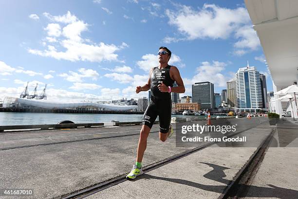 Second placed Leon Griffin of Australia runs along Princes Wharf during Ironman 70.0 on January 18, 2015 in Auckland, New Zealand.